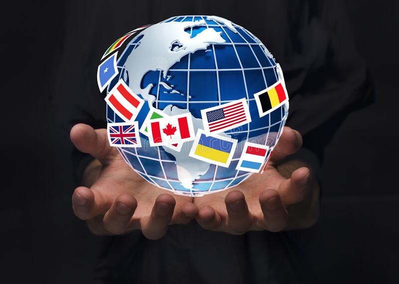 upload/closeup-man-holding-planet-earth-surrounded-international-flags-black-back.jpg